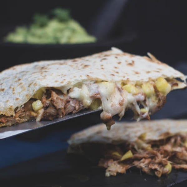 A delicious quesadilla from Taqueria Cuernavaca, filled with melted cheese, meat, and pineapple.